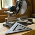Speed square used to test miter saw fence squareness