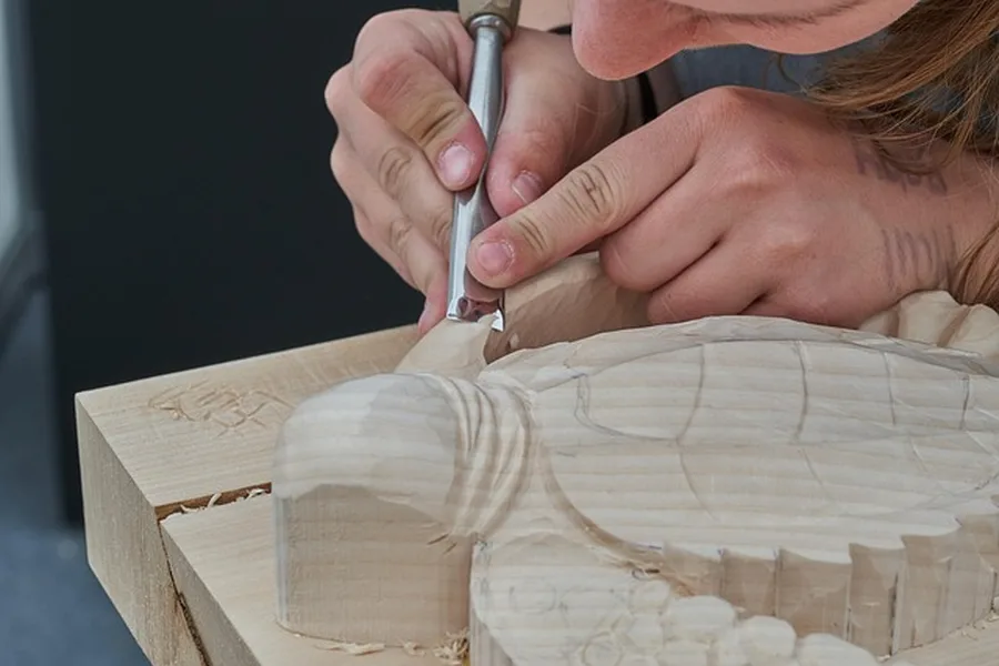 Hand-carving a wooden sword from a wood blank