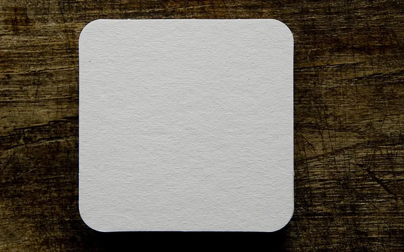 Stack of coasters on a wood table Stack of coasters on a wood table