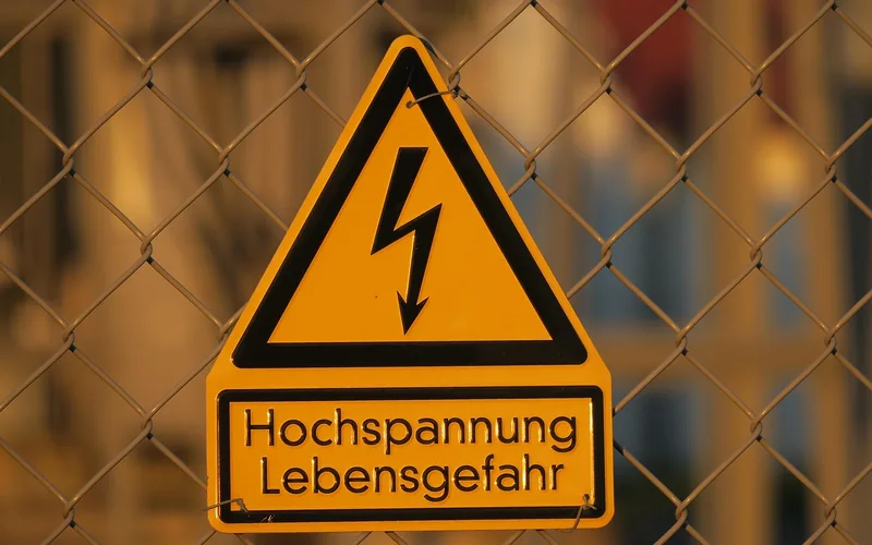 high voltage danger warning sign representing the electrocution risk of DIY fractal burning equipment