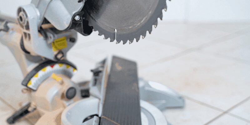 Bevel adjustment lever on a circular saw base plate set near 45 degrees