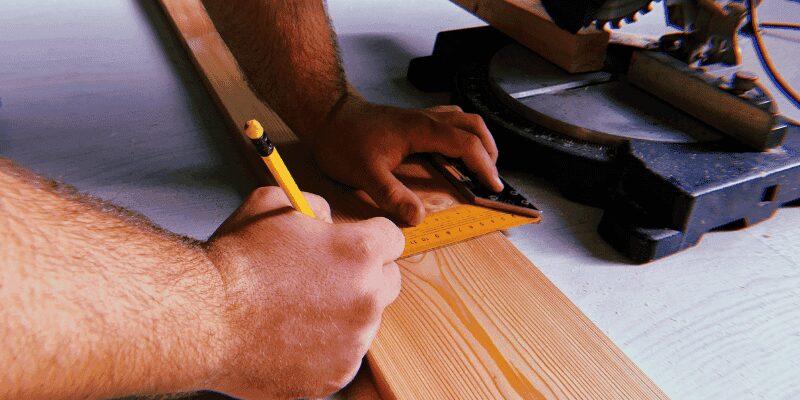 miter gauge set to a 60 degree angle on a table saw for an angled crosscut