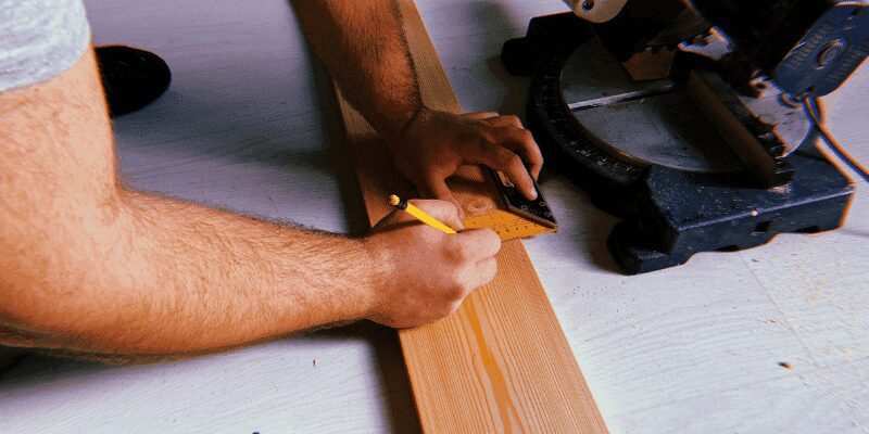 finished 60 degree angled cut on a wood board on a table saw