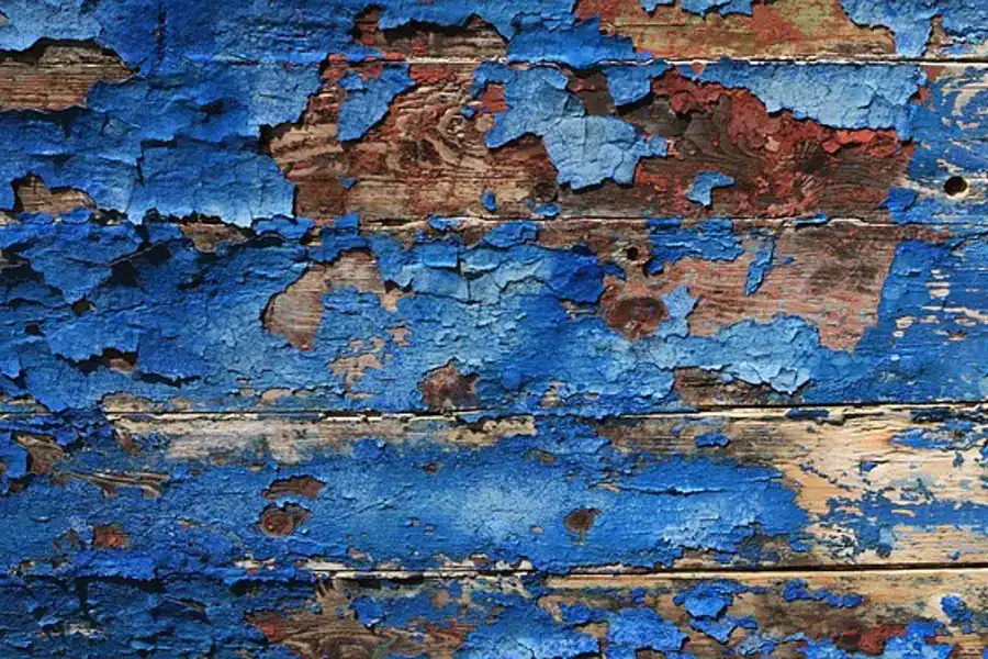 Peeling paint and finish on an old wood surface