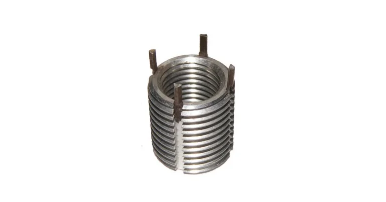 Close-up of a helical coil thread insert showing internal threads