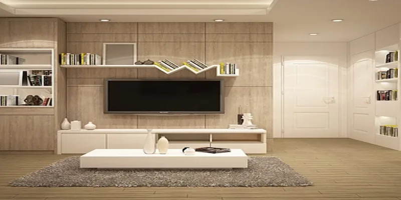 Wiping wood furniture clean with a soft, soapy cloth