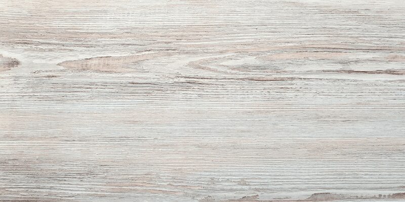Close-up of white-washed wood grain texture used to choose the right stain color effect
