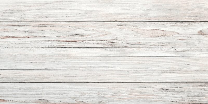 Painted white wood furniture piece finished with a solid white wash