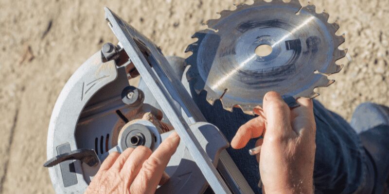 Removing the old blade from a DeWalt miter saw arbor