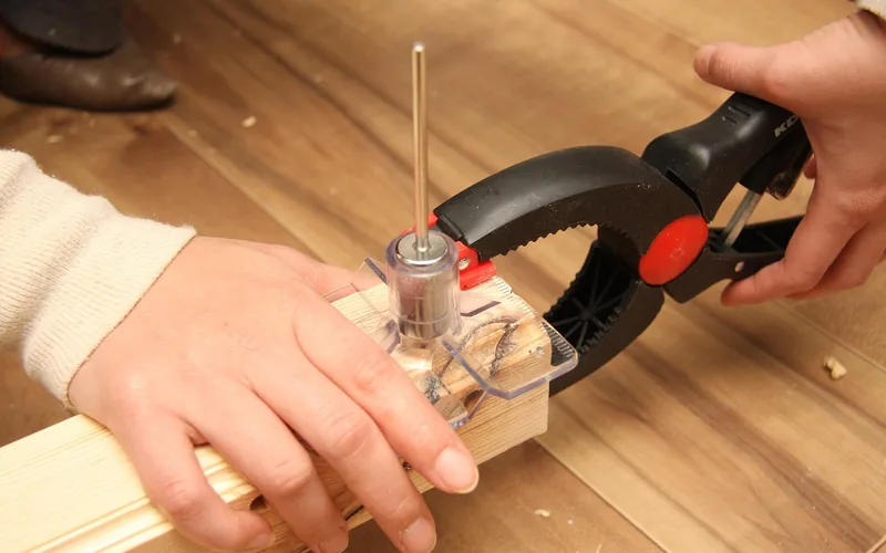 bar clamps applying even pressure across a wood glue joint in a workshop bar clamps applying even pressure across a wood glue joint in a workshop