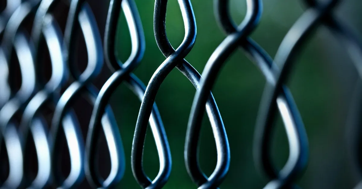 close-up of galvanized steel chain link fence mesh