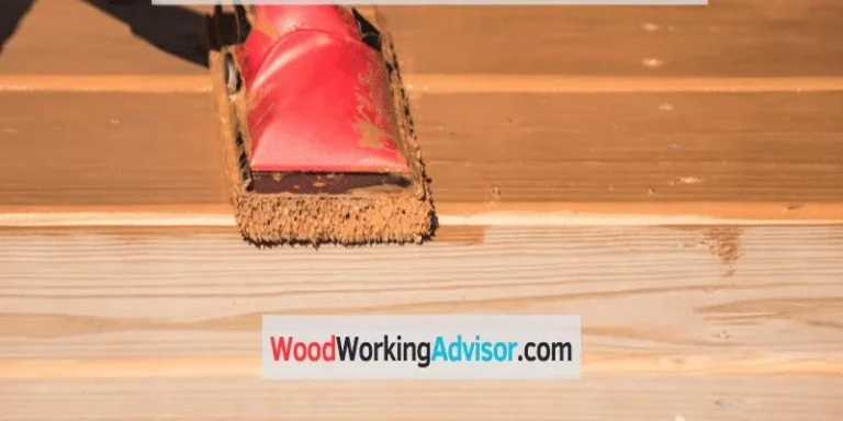 Applying transparent stain to a deck board