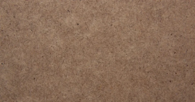 Close-up of an MDF board surface showing fine compressed wood fibers and no grain