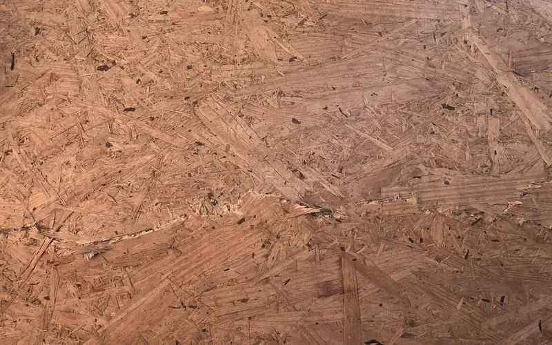 Close-up of an OSB panel surface made of pressed wood strands