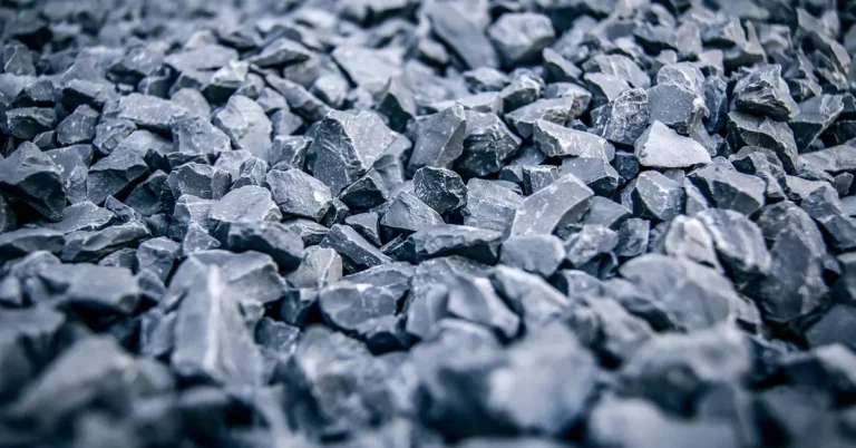 Close-up of blue-gray crushed stone used for a compacted shed gravel base