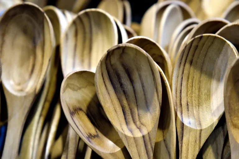 Stack of wooden spoons showing natural grain