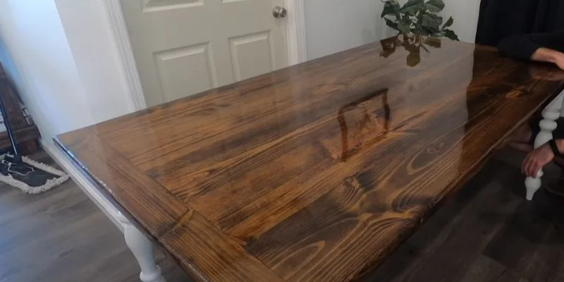 Finished plywood tabletop with a glossy stained wood grain surface