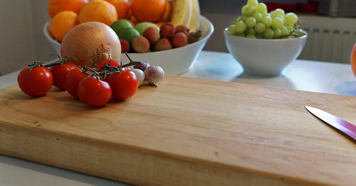 Thick solid wood butcher block board on a kitchen counter