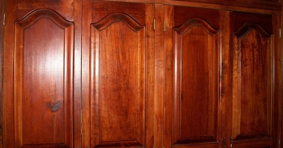 Solid cedar wood closet doors showing natural reddish-brown grain