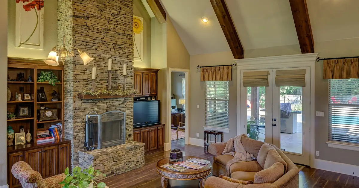 living room with dark hardwood floor and neutral tan furniture