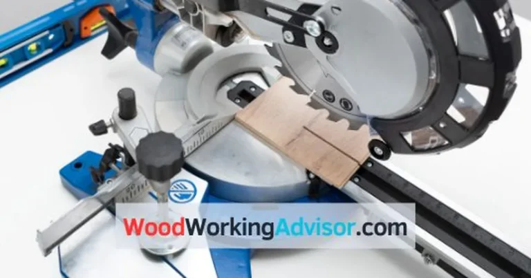 Blue sliding compound miter saw cutting a wood block
