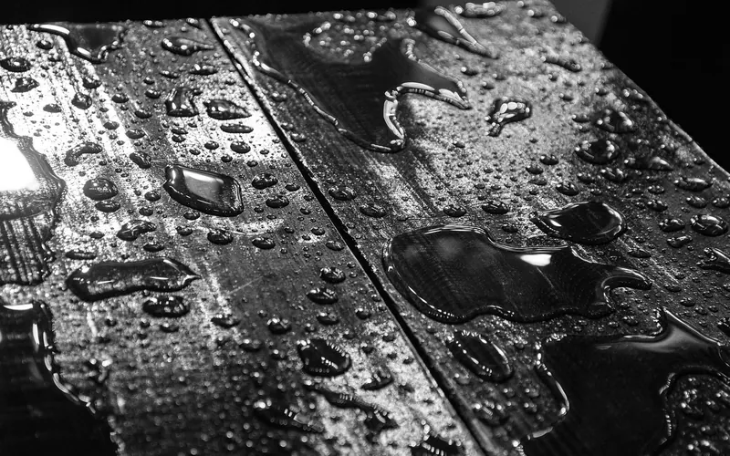 Water droplets pooled on wood boards Water droplets pooled on wood boards