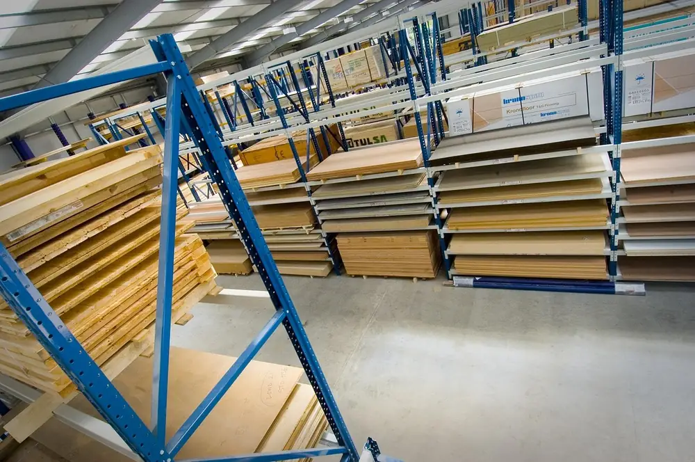 Stacked plywood sheets at a lumber supplier warehouse