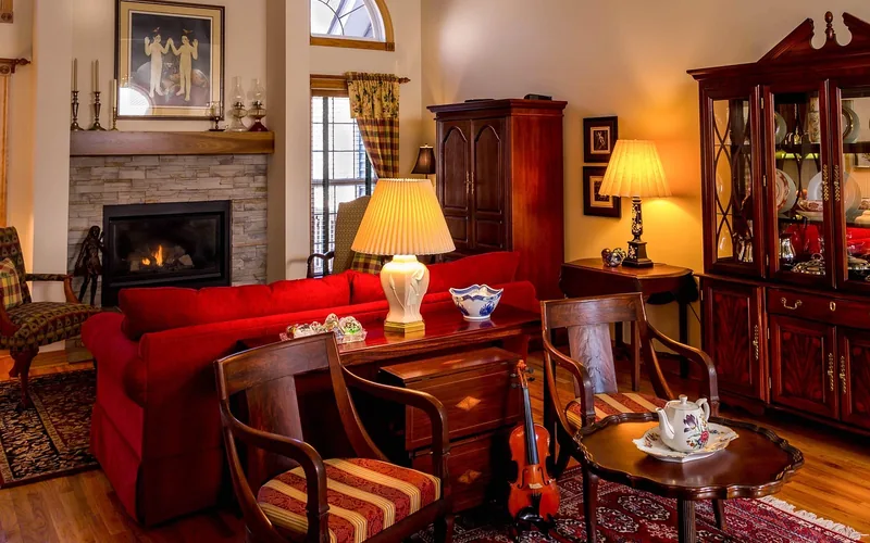 Area rug placed over a hardwood floor in a living room Area rug placed over a hardwood floor in a living room