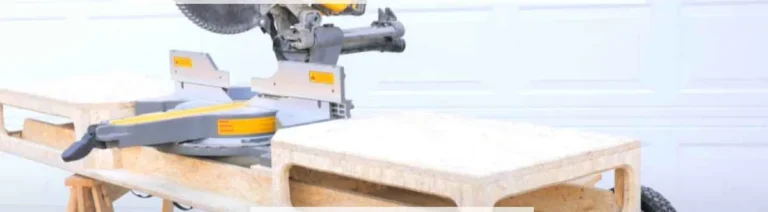 DeWalt miter saw mounted on a rolling stand with wheels in a home garage workshop