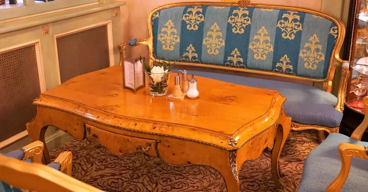 Polished wooden coffee table with a glossy finish in a sitting room Polished wooden coffee table with a glossy finish in a sitting room