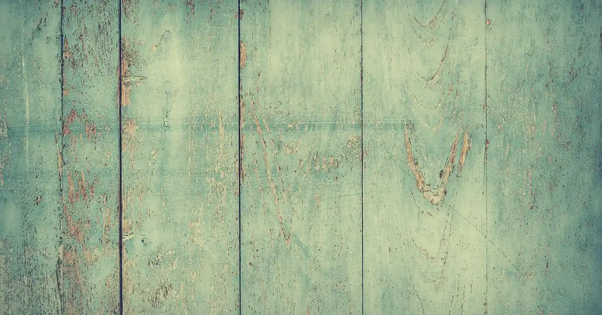 Teal painted hardwood floor planks showing a durable colored paint finish