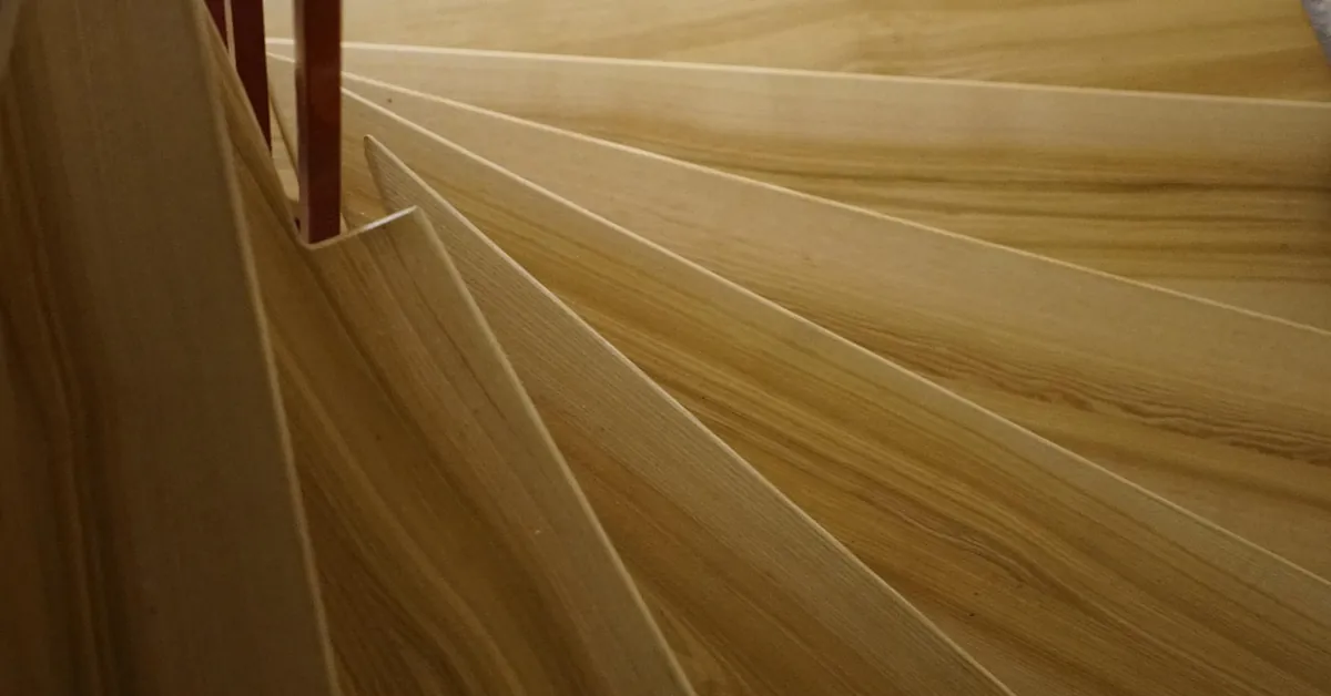 Hardwood stair treads cut from light wood boards