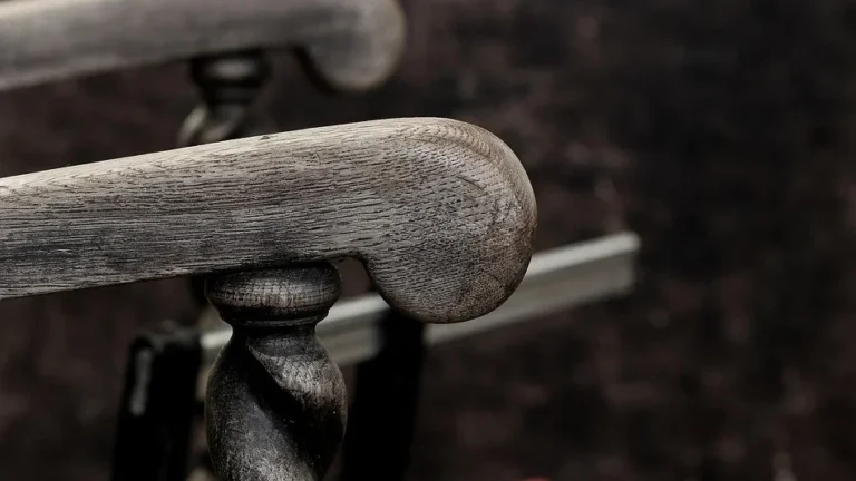 Oak chair arm clamped during a wood repair
