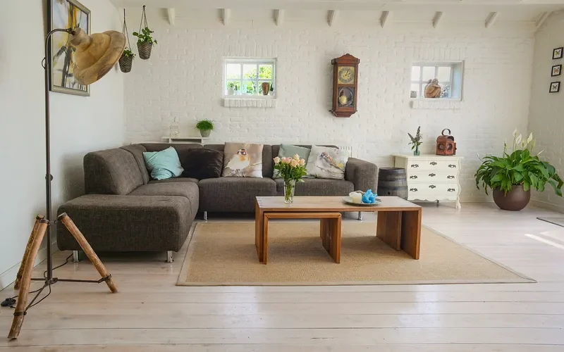 Natural fiber area rug under a coffee table on a light wood floor Natural fiber area rug under a coffee table on a light wood floor
