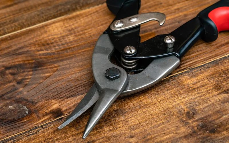 close-up of a metal snip jaw and spring-loaded pivot mechanism