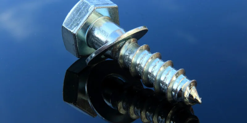 Close-up of a stuck screw in wood