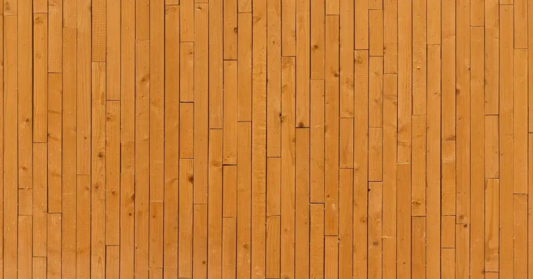 Close-up of vertical wood panelling boards installed upright on an interior wall