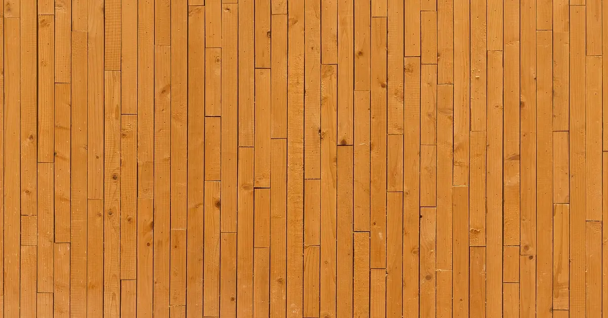 Close-up of vertical wood panelling boards installed upright on an interior wall
