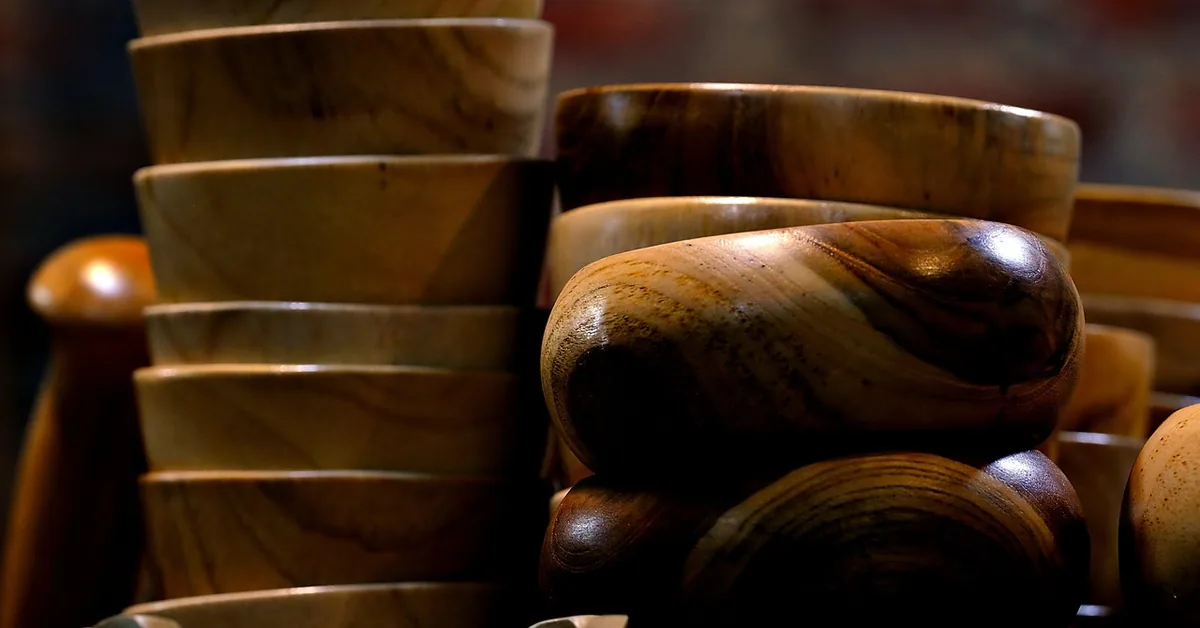 handmade wooden crafts displayed for sale at a market stall