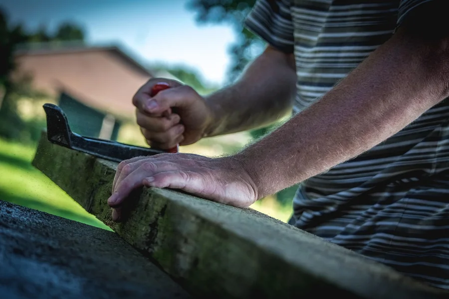 Working with lumber on an outdoor woodworking build Working with lumber on an outdoor woodworking build