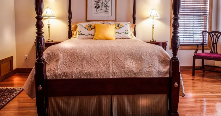 traditional bedroom with warm hardwood flooring and a four-poster bed