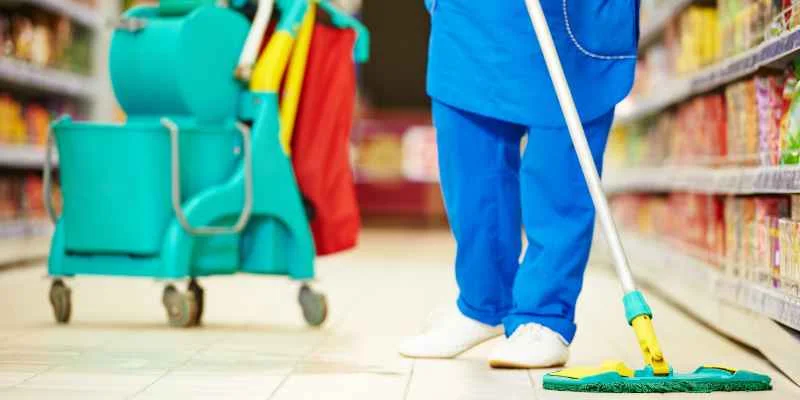 Sweeping cork flooring to remove abrasive dirt particles
