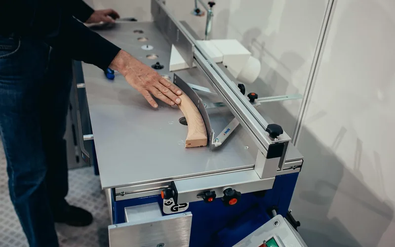 CNC milling machine cutting wood in a workshop
