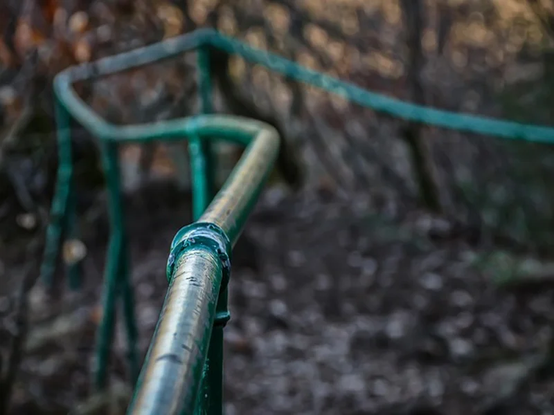 An iron handrail, an example of ferrous metal that needs a rust-inhibiting primer