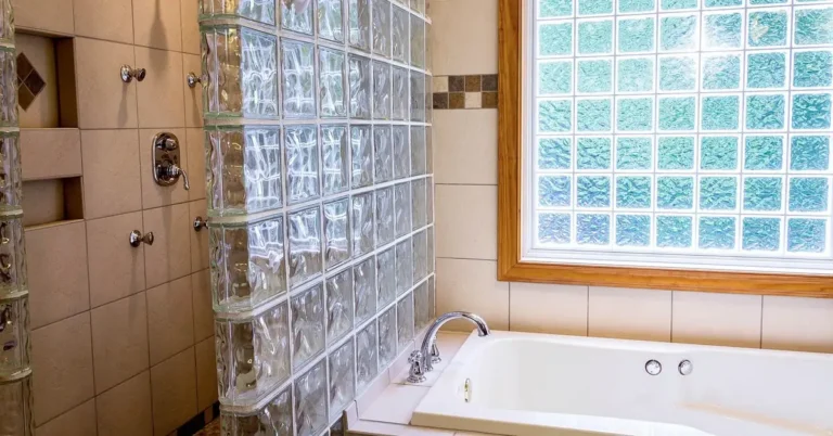 glass block window installed in a bathroom wall, providing privacy and natural light