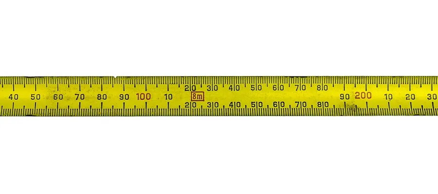 Measuring tape used to check plank width and thickness before cutting Measuring tape used to check plank width and thickness before cutting