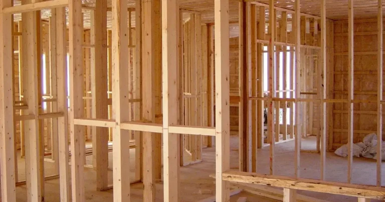 House interior with framed walls and floor framing under construction