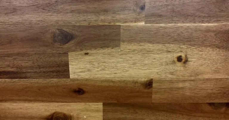 Alternating light and dark hardwood floor planks showing the color contrast between lighter oak and darker walnut tones