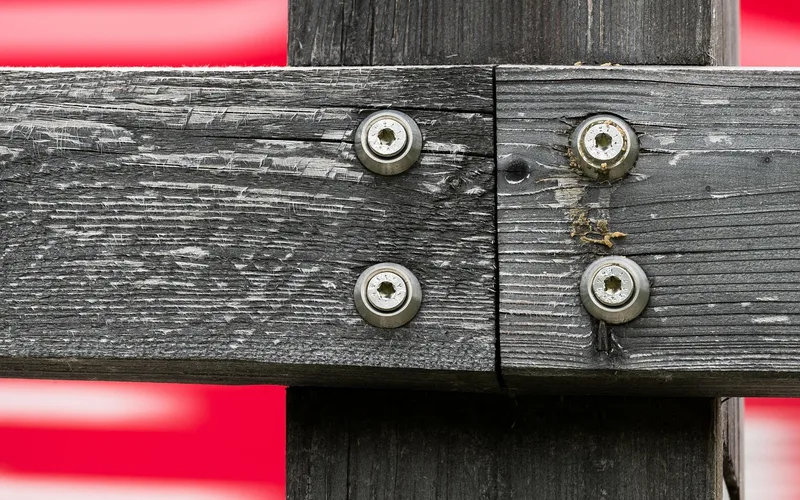 washer-head structural screws fastening two timber members at a post and rail joint