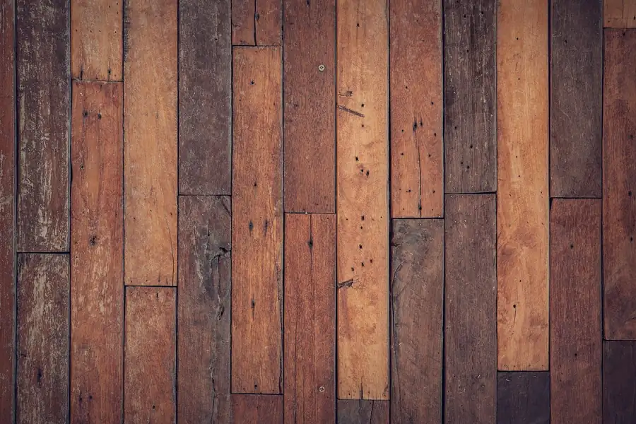 Close-up of installed plank flooring showing width and seam pattern Close-up of installed plank flooring showing width and seam pattern